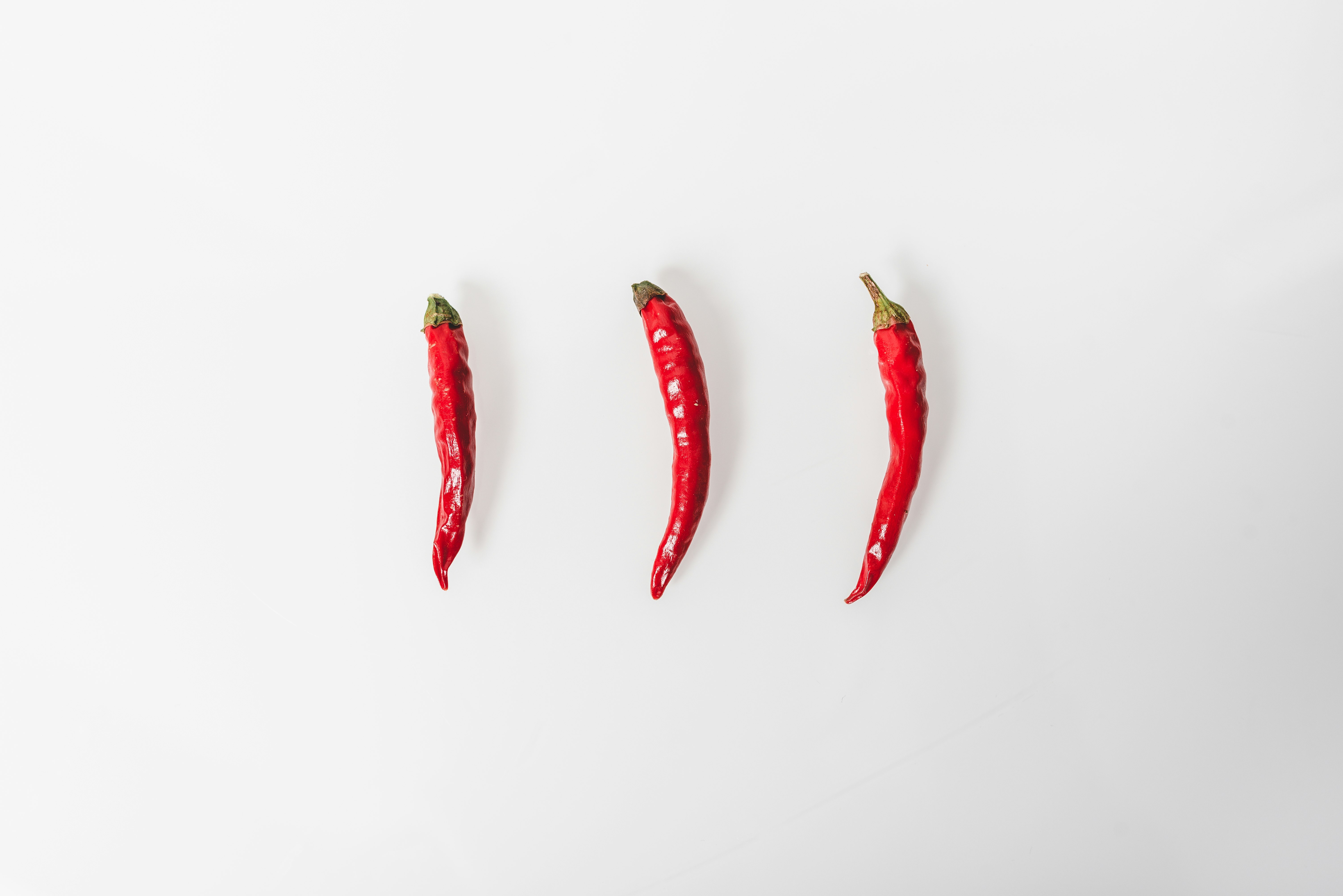 red chili on white surface